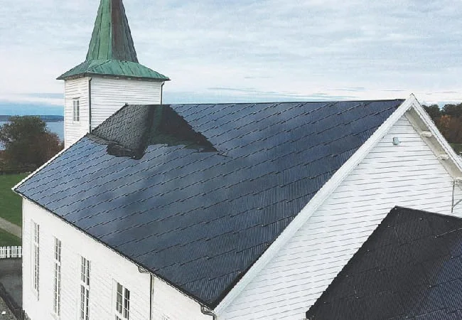 SunStyle solar tiles on a renovated historic church roof in Norway
