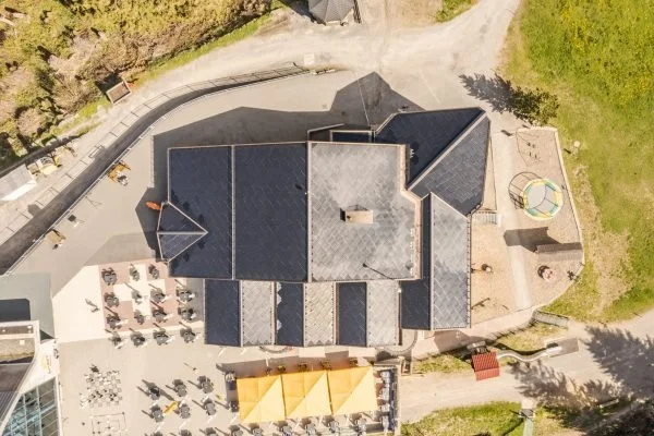 Aerial view of SunStyle solar tiles on the roof of Ristis Restaurant at Brunni