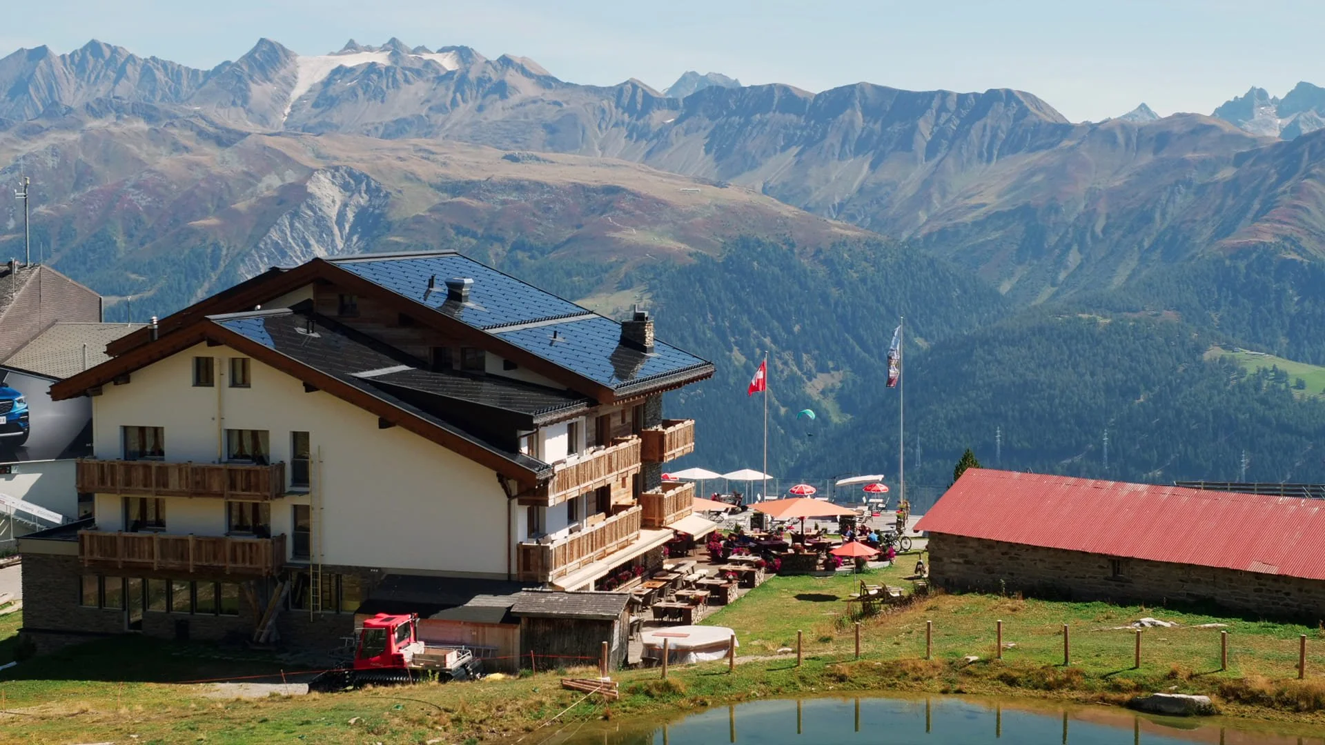 SunStyle Photovoltaic Solar Roof BIPV on multi-family residence in Swiss Alps