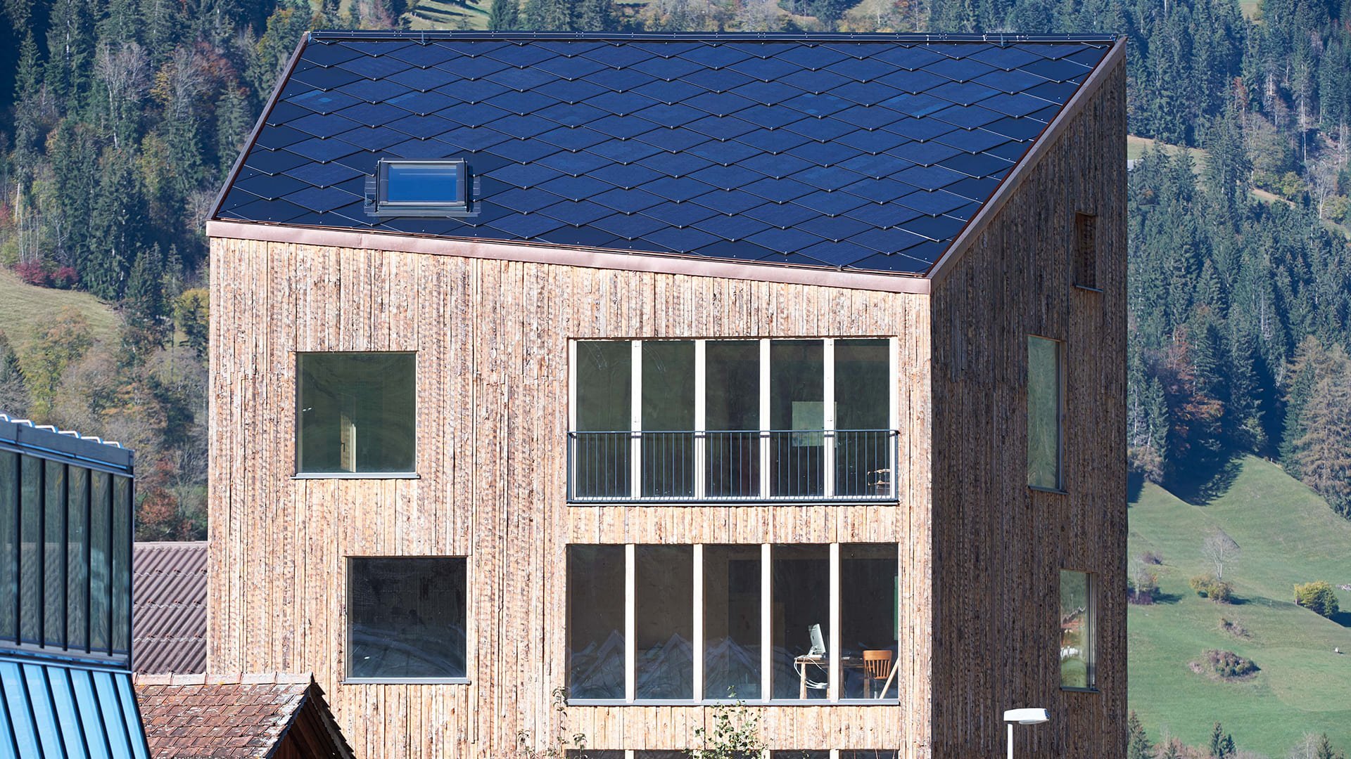 SunStyle solar tiles used on this cradle-to-cradle mixed use residential and commercial building with a solar roof