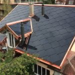 SunStyle solar tiles on a multi-family housing building where active solar tiles cover all areas that receive maximum sunlight.