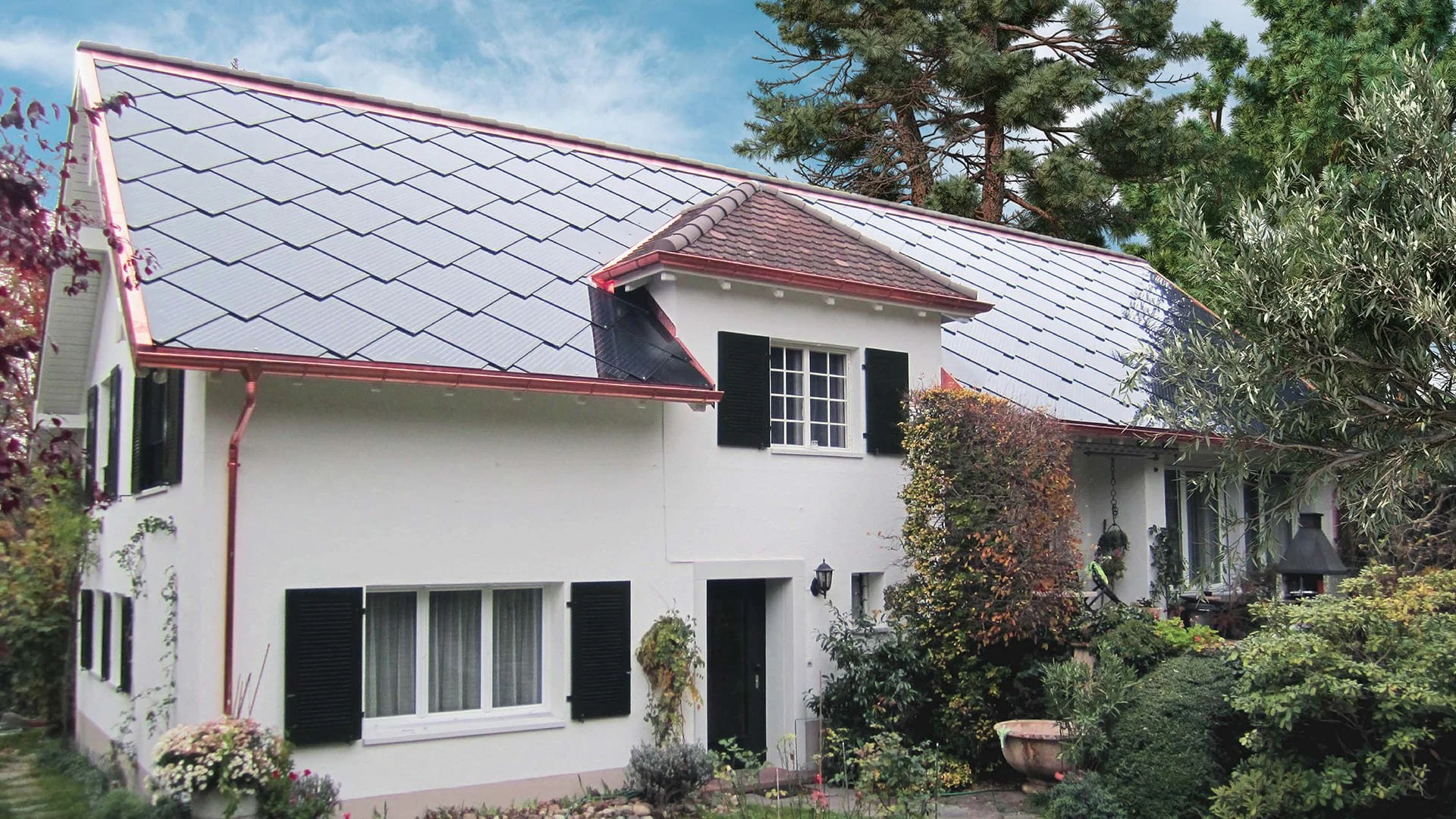 SunStyle solar tiles on a single family residence to create an eco-friendly home by adding a solar roof