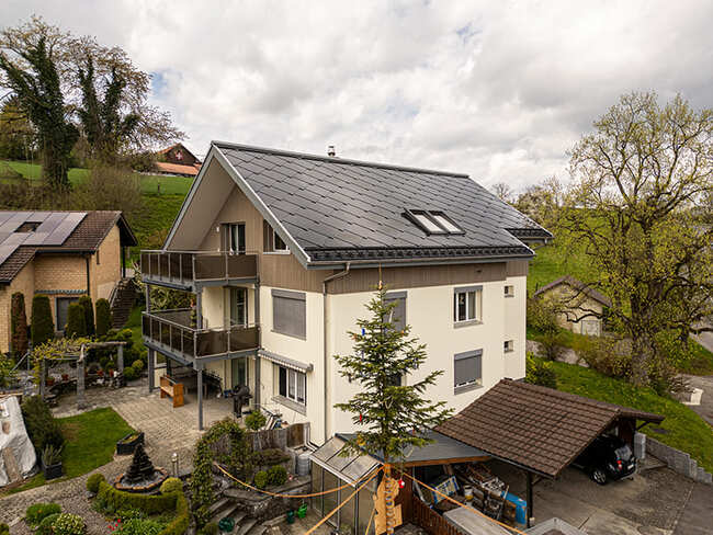 House with solar panels and solar tiles of Sunstyle